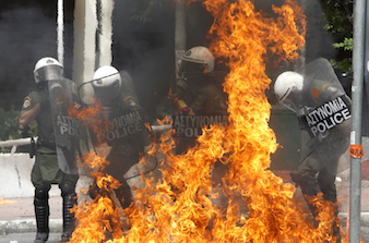 Riot police hit with molotov cocktail during nationwide strike over austerity measures in Athens
