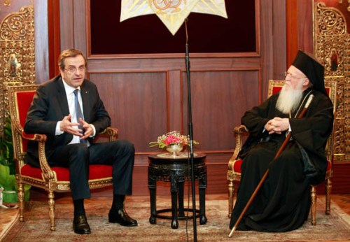 Greece's Prime Minister Antonis Samaras gestures as he meets the Ecumenical Greek Orthodox Patriarch Bartholomew I at the patriarchate in Istanbul