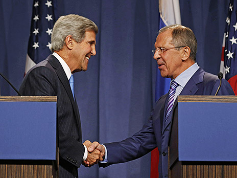 U.S. Secretary of State Kerry shakes hands with Russian Foreign Minister Lavrov after delivering opening remarks to the media before their meeting to discuss the ongoing crisis in Syria, in Geneva