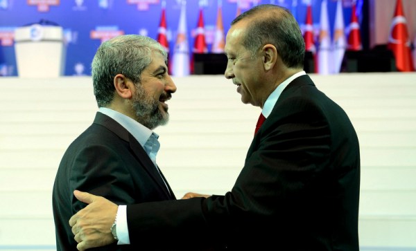 Turkey's Prime Minister and leader of ruling Justice and Development Party Erdogan welcomes his guest Hamas leader Meshaal during the AKP congress in Ankara