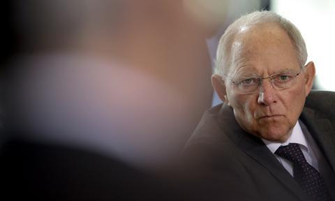 German Finance Minister Wolfgang Schaeuble attends the weekly cabinet meeting at the chancellery in Berlin, Germany, Wednesday, March 18, 2015. (AP Photo/Michael Sohn)