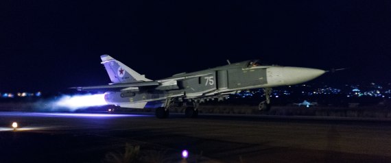 This handout photo released by the Russian Defense Ministry official web site shows a Russian Su-24 bomber taking off on a night combat mission from Hemeimeem airbase in Syria, late Thursday, Oct. 22, 2015. Russian jets regularly hit targets at night, a capability the Russian air force lacked until recently. (Vadim Savitsky/Russian Defense Ministry Press Service via AP)