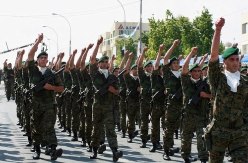 Cypriot national guard commandos march during a military parade to mark the island's Independence Day in Nicosia 01 October 2006. Several European officials warned this week that the Cyprus issue could lead to a crisis for Turkey's talks on European Union membership. Cyprus has been divided since 1974 when Turkish troops invaded and occupied the northern third in response to an attempt by Greek Cypriots to unite the island with Greece. AFP PHOTO/ALEX MITA (Photo credit should read ALEX MITA/AFP/Getty Images)