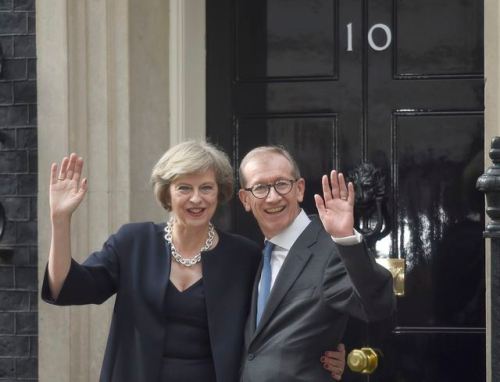 Britain's Prime Minister, Theresa May, and husband Philip pose for the media outside number 10 Downing Street, in central London, Britain July 13, 2016. REUTERS/Toby Melville