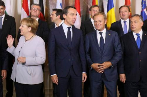 Germany Chancellor Angela Merkel, Austrian Chancellor Christian Kern, Donald Tusk, president of the European Council and Hungarian Prime Minister Viktor Orban, from left, line up for a group photo after a meeting of the government heads from Germany, Austria and West Balkans on strategies to deal with Europe's migrant crisis in Vienna, Austria, Saturday, Sept. 24, 2016. (AP Photo/Ronald Zak)